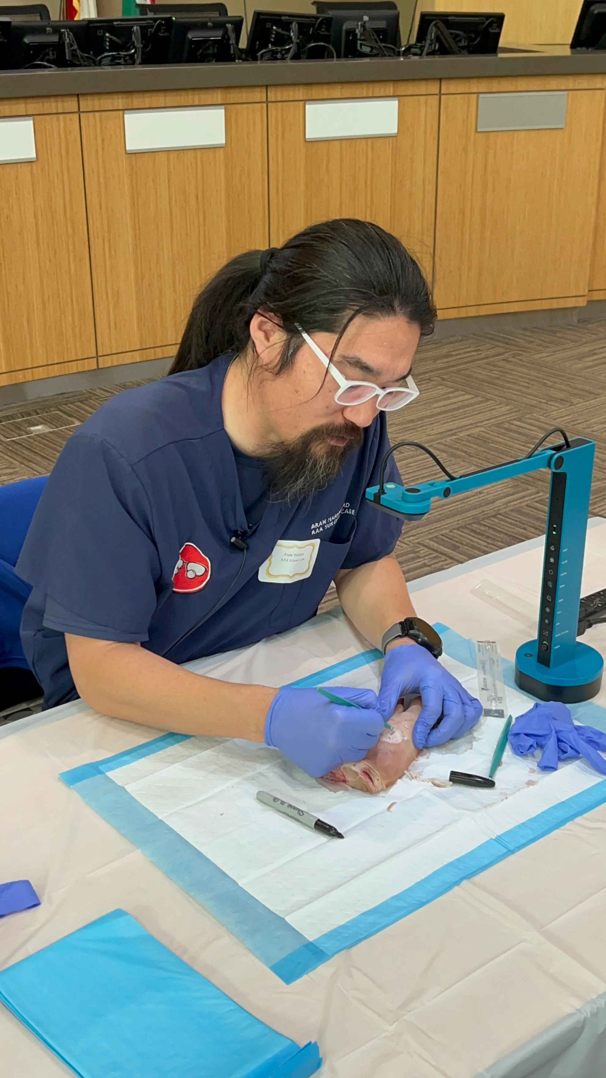 Wound care medical professional teaching a procedure.